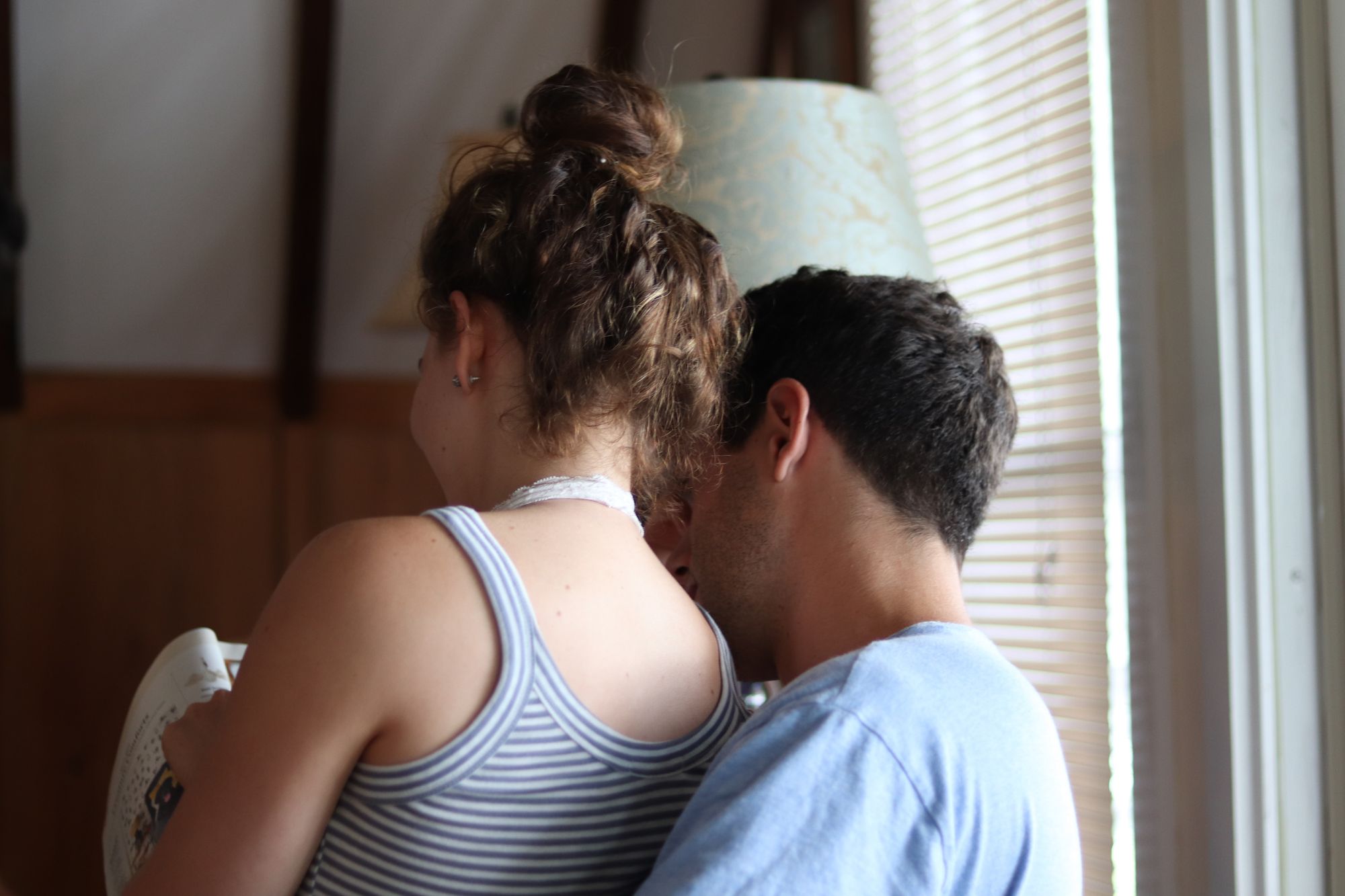 Straight couple looking at a magazine together