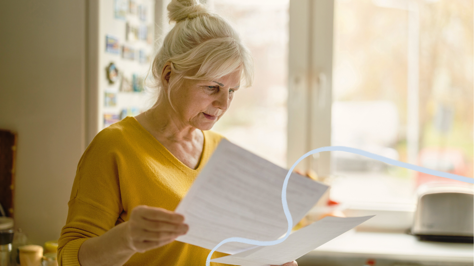 an adult looking at papers looking concerned